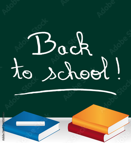 Back to school ! chalked on blackboard. Classroom.