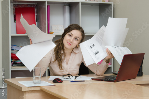 Office Specialist with a bunch of papers photo