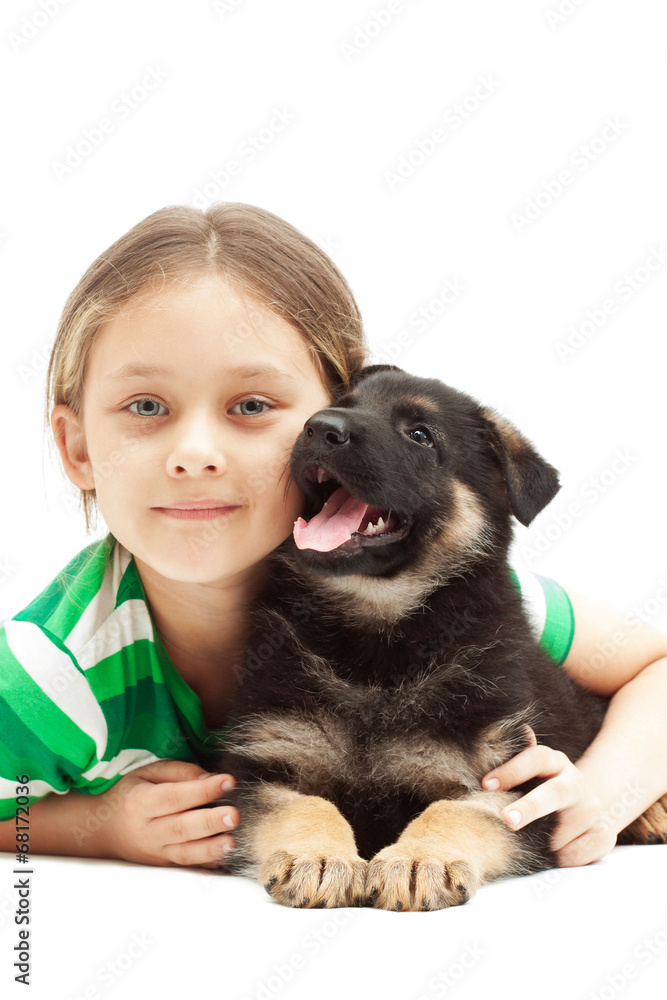 child hugging a puppy German Shepherd child hugging a puppy German Shepherd