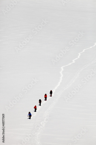 Team of alpinists crossing a glacier