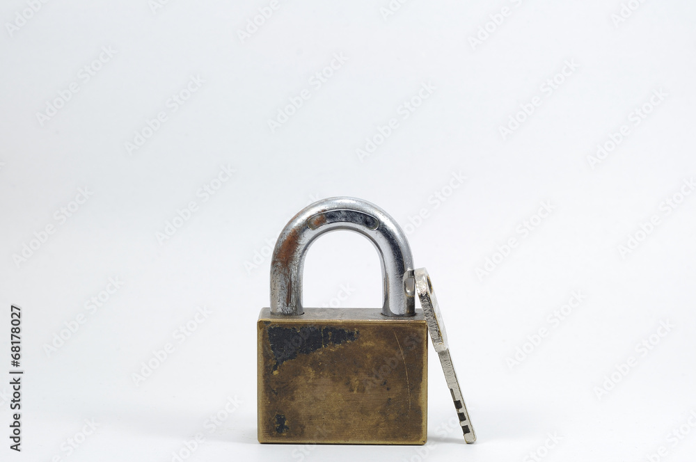 Single padlock with key on white background. Single padlock with key on white background.