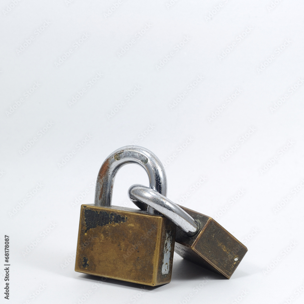 Double padlocks with key on white background. Double padlocks with key on white background.