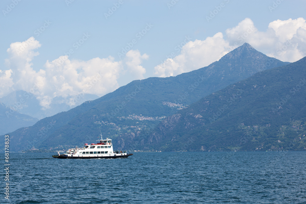 Boat against mountains on Lake Como