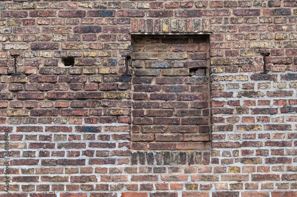 Wall of brick with a walled up window texture Wall of brick with a walled up window texture