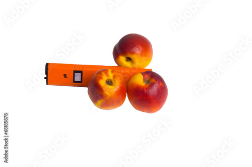 peaches with electric device isolated on white