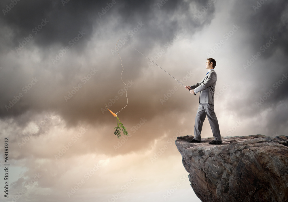 Businessman with rod