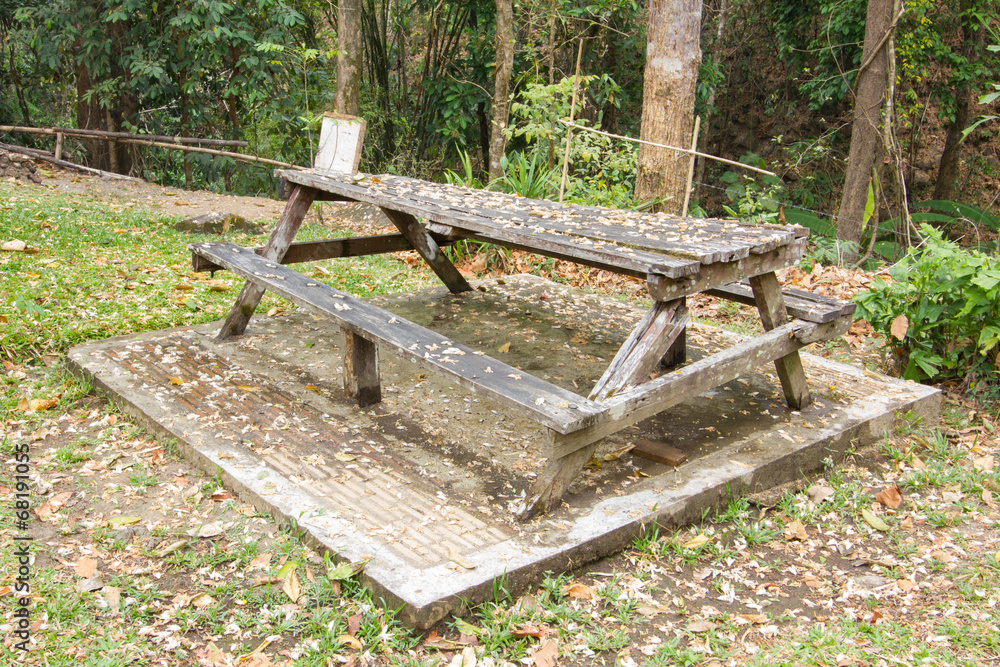 Abandoned wooden bench in thai public park Abandoned wooden bench in thai public park