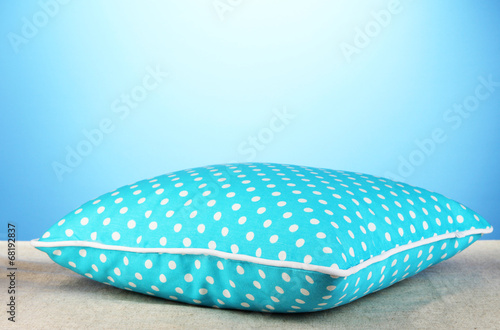Blue bright pillow on blue background © Africa Studio