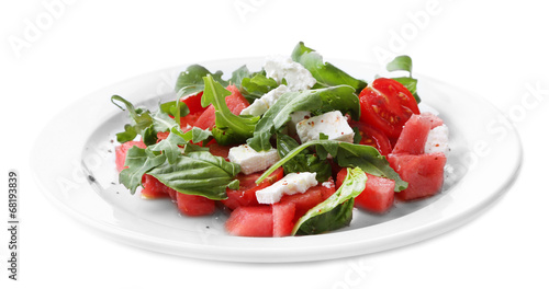 Salad with watermelon, feta, arugula and basil leaves