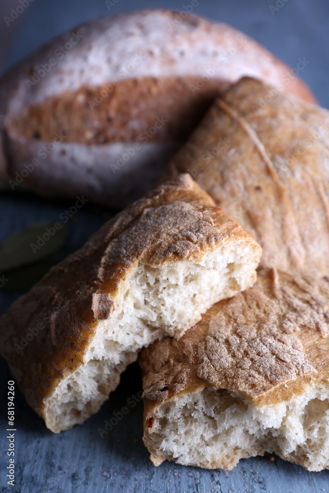 Fresh baked bread on wooden background Fresh baked bread on wooden background