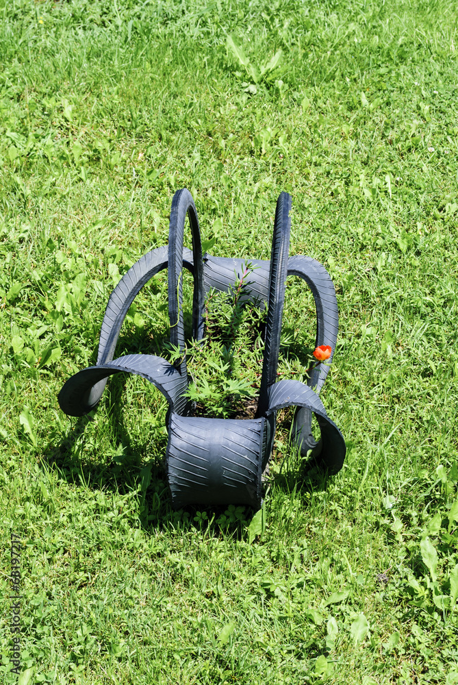 Fototapeta premium Flowerpot made of a tire