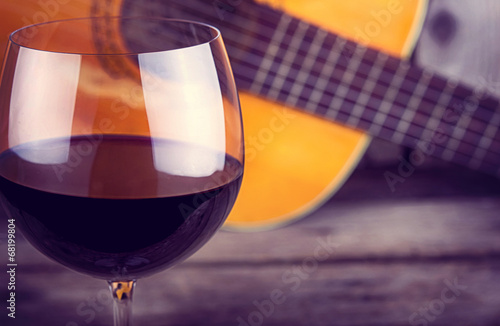 Photography guitar and Wine on a wooden table