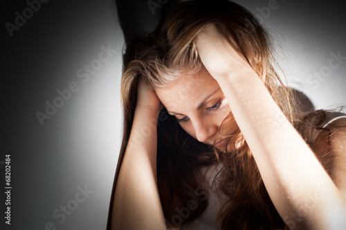 Young woman suffering from a severe depression, anxiety photo