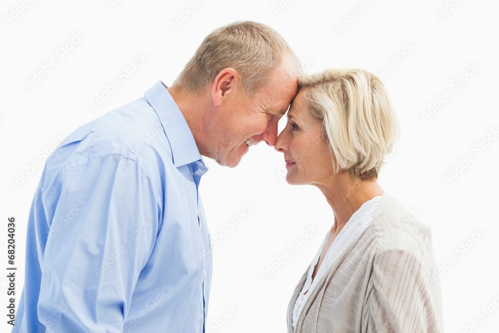 Happy mature couple facing each other Happy mature couple facing each other