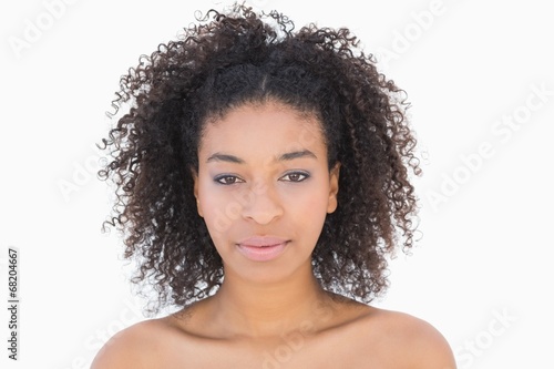 Pretty girl with afro hairstyle smiling at camera