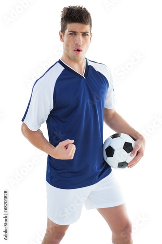 Football player in blue celebrating