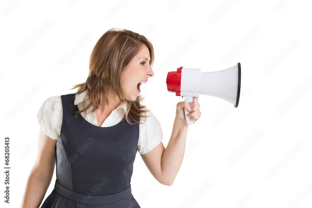 Young businesswoman shouting into bullhorn Young businesswoman shouting into bullhorn
