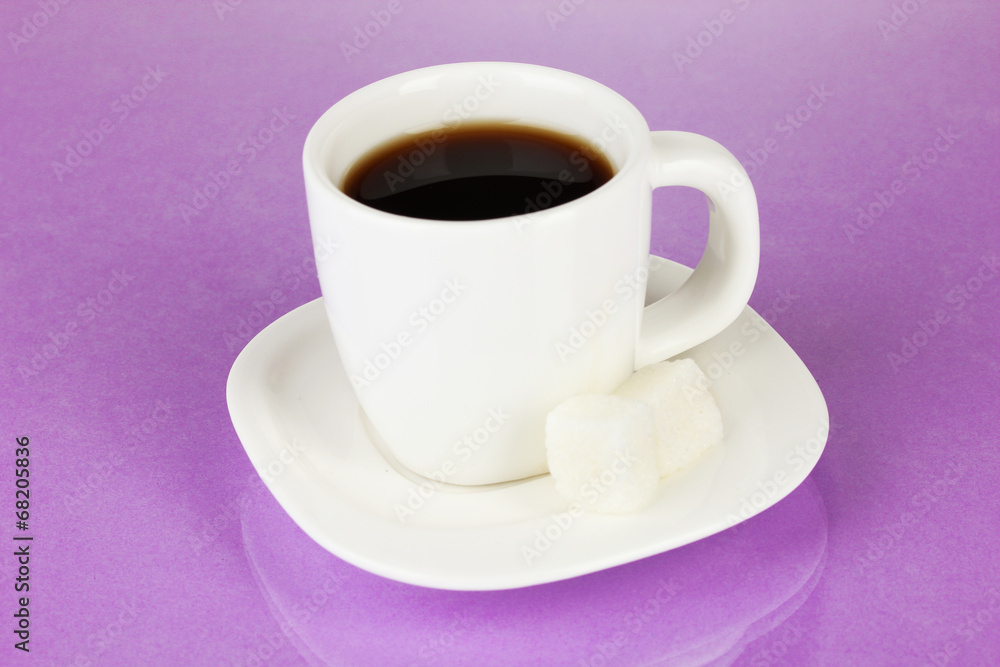 A cup of strong coffee on purple background A cup of strong coffee on purple background