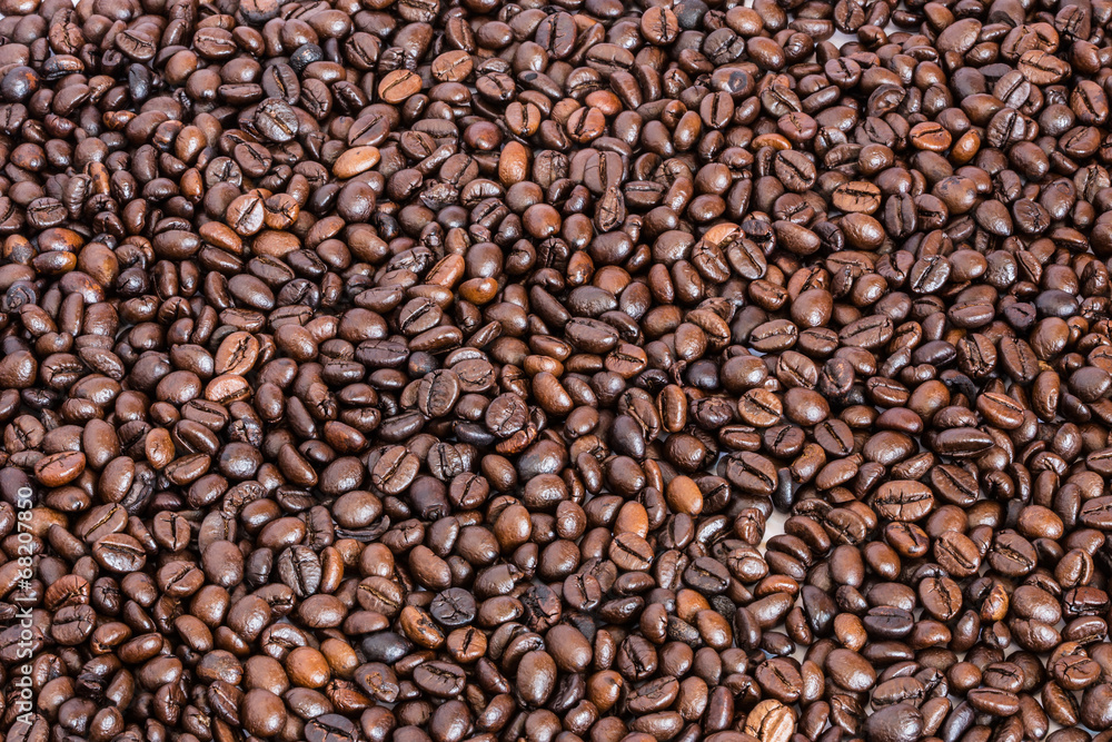 many roasted coffee beans background many roasted coffee beans background