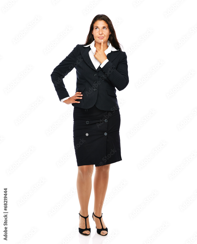 Business woman in black suit standing looking up, thinking Business woman in black suit standing looking up, thinking
