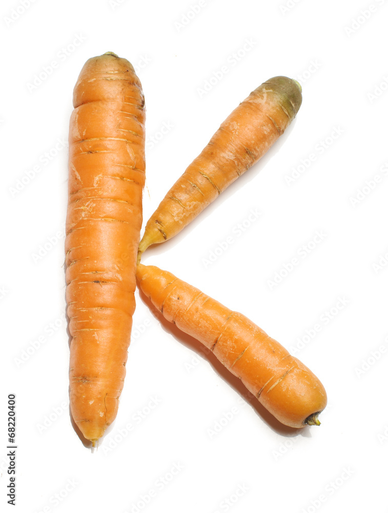 Alphabet letter K arranged from fresh carrots isolated Alphabet letter K arranged from fresh carrots isolated