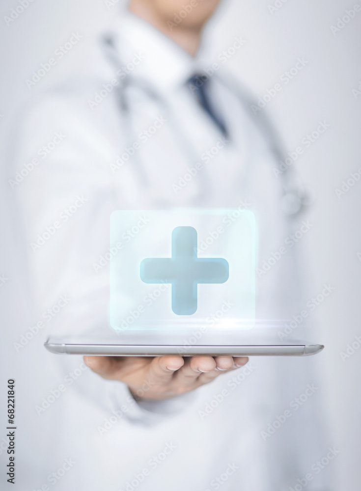 male doctor holding tablet pc with medical app male doctor holding tablet pc with medical app
