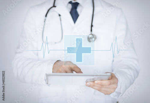 male doctor holding tablet pc with medical app