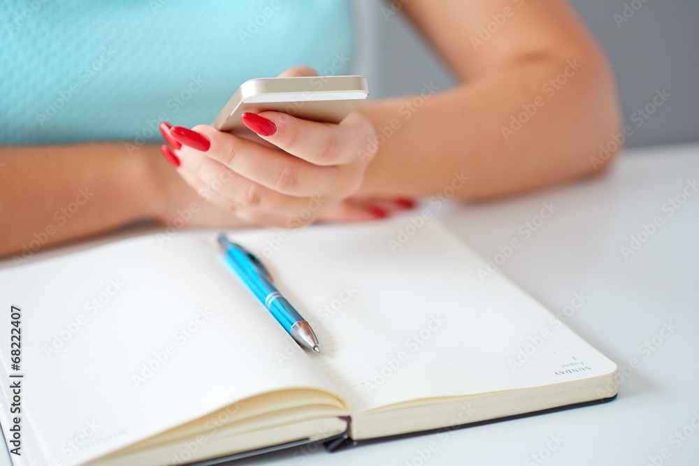 Young woman working with a mobile phone Young woman working with a mobile phone