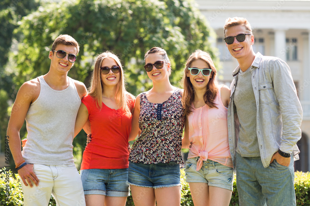 group of smiling friends outdoors