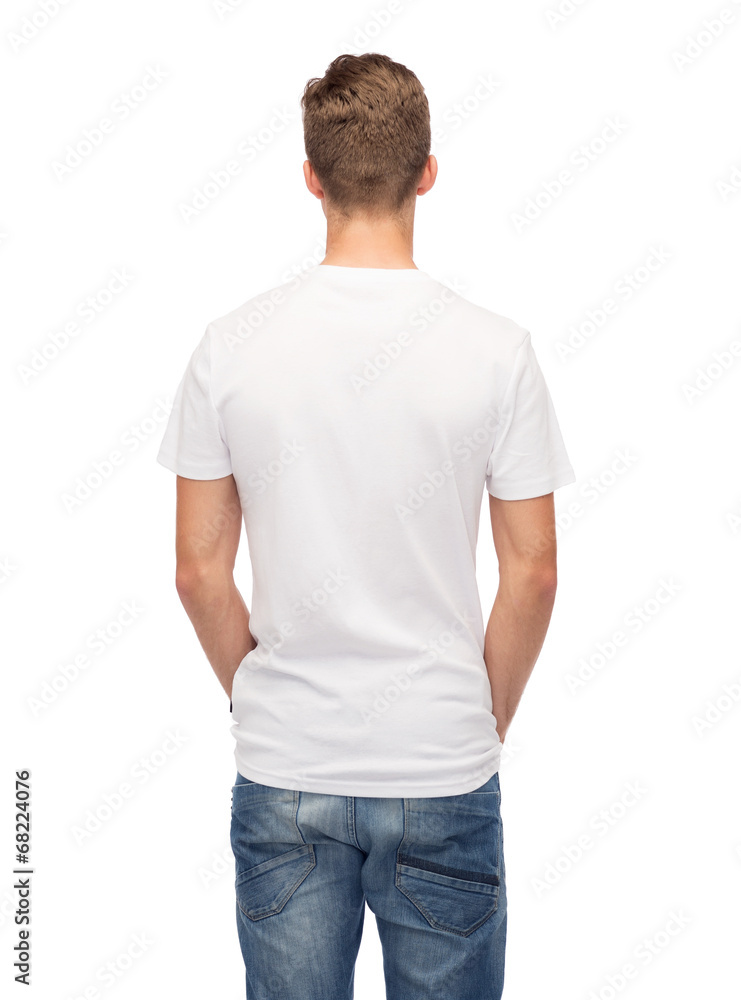 Fototapeta premium young man in blank white t-shirt from back
