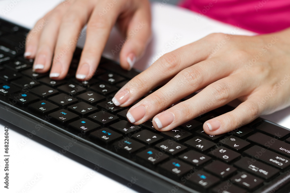 Woman Typing On A Black Keyboard Woman Typing On A Black Keyboard