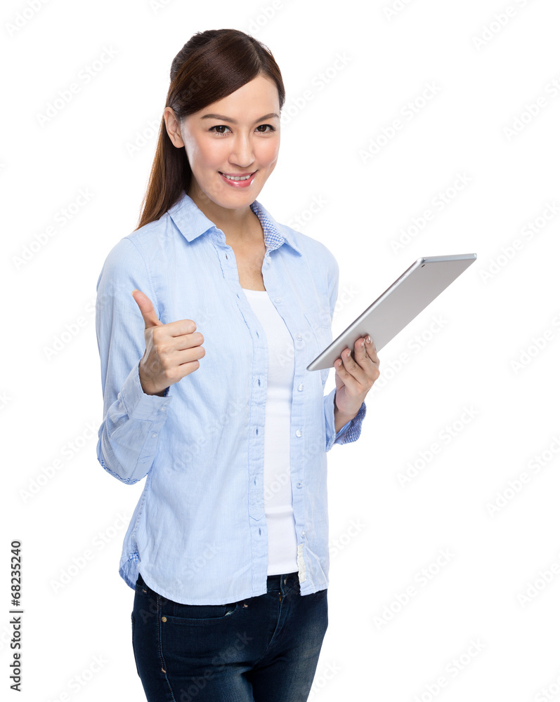 Asian woman use digital tablet and thumb up