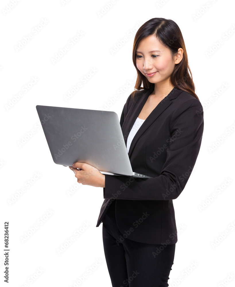 Business woman look at laptop computer Business woman look at laptop computer