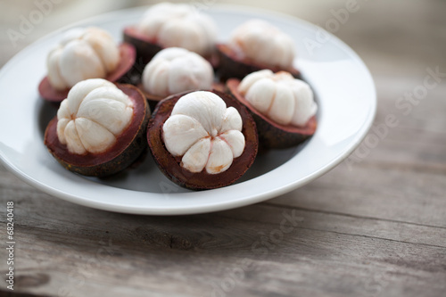 tropical mangosteen fruit on wood table