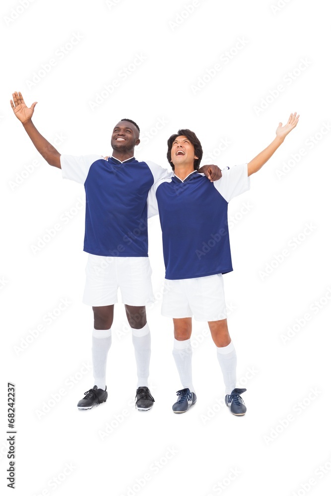 Fototapeta premium Football players in blue celebrating