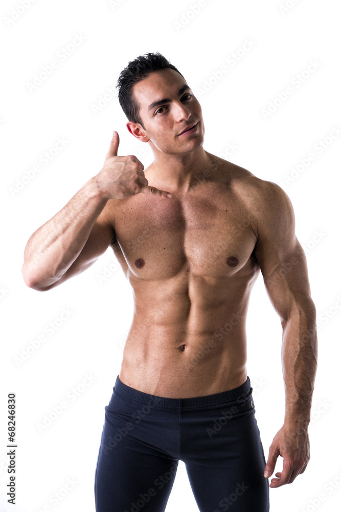 Handsome male model doing call me gesture Handsome male model doing call me gesture