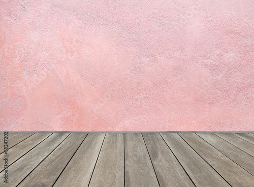 Wooden floor and pastel pink background