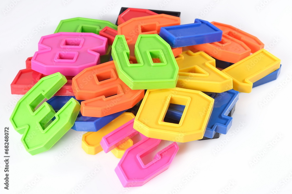 Fototapeta premium Colorful plastic numbers on a white