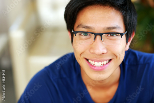 Closeup portrait of a cheerful asian man