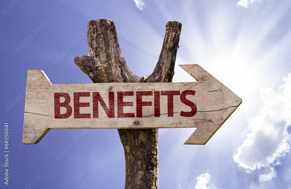 Benefits wooden sign on a beautiful day