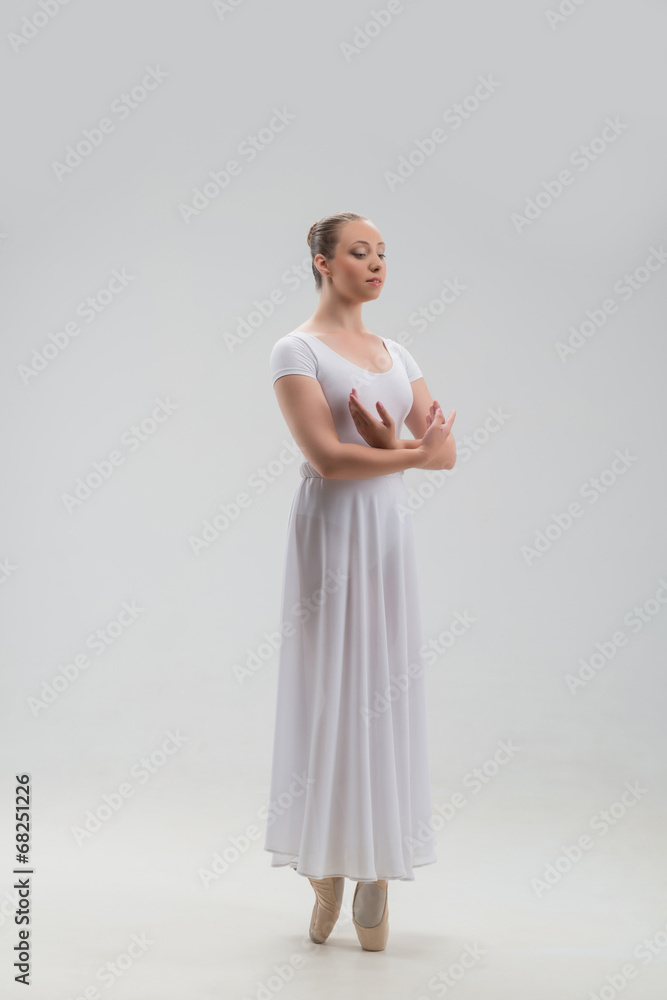 Young and beautiful ballet dancer posing isolated Young and beautiful ballet dancer posing isolated