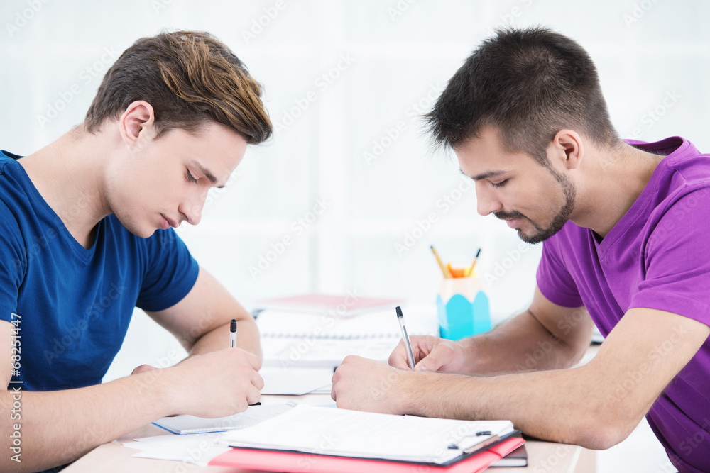 Students taking notes in classroom Students taking notes in classroom