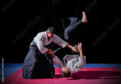Fight between two aikido fighters photo