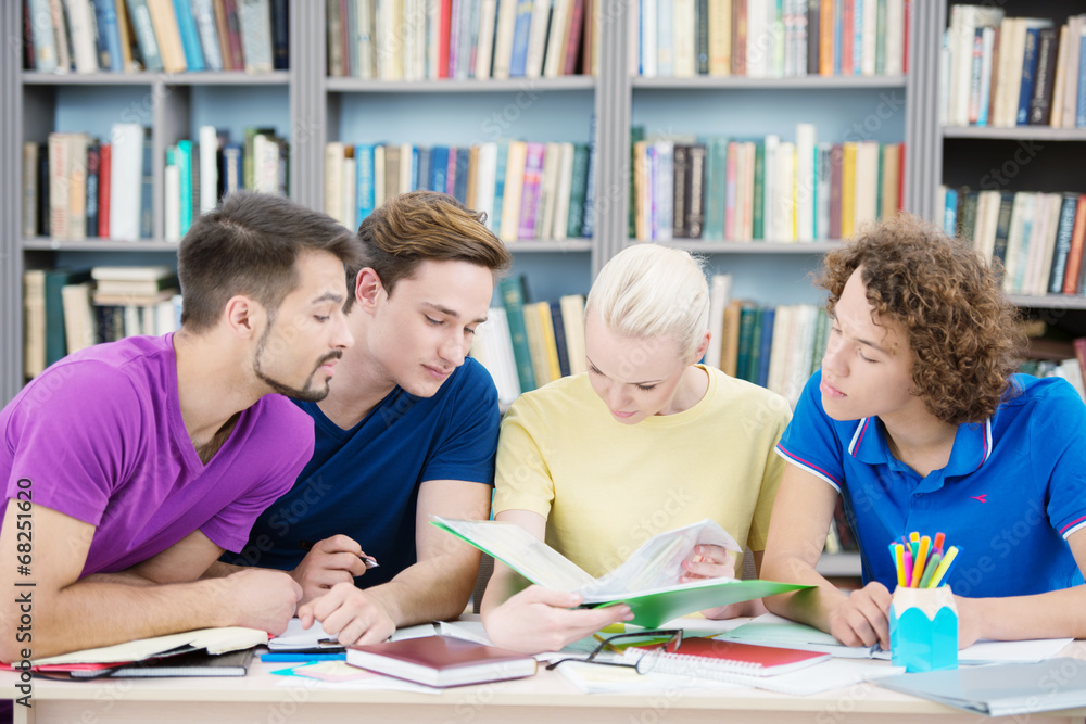 Students reading new information in classroom Students reading new information in classroom