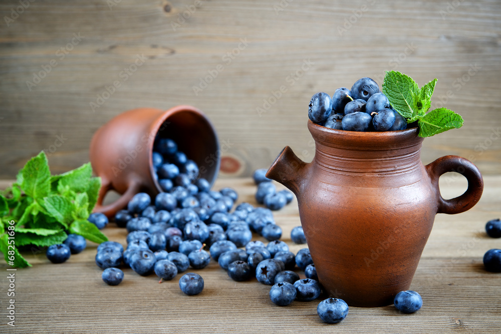 Naklejka Fresh blueberries in a rustic jug