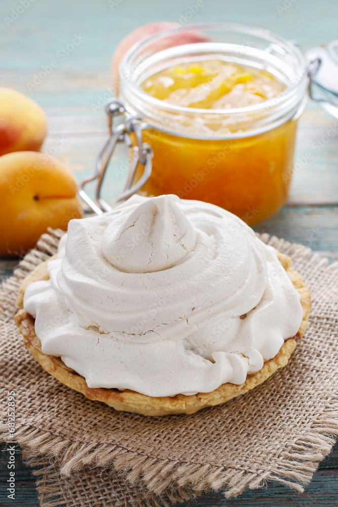 Pavlova cake filled with peach jam Pavlova cake filled with peach jam