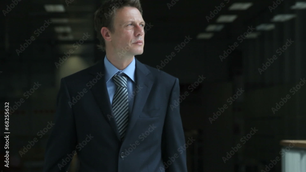 Businessman walking with trolley Businessman walking with trolley