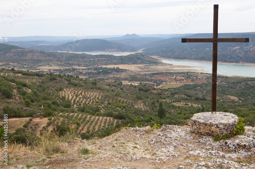 Catholic cross over Alcarria landscape photo