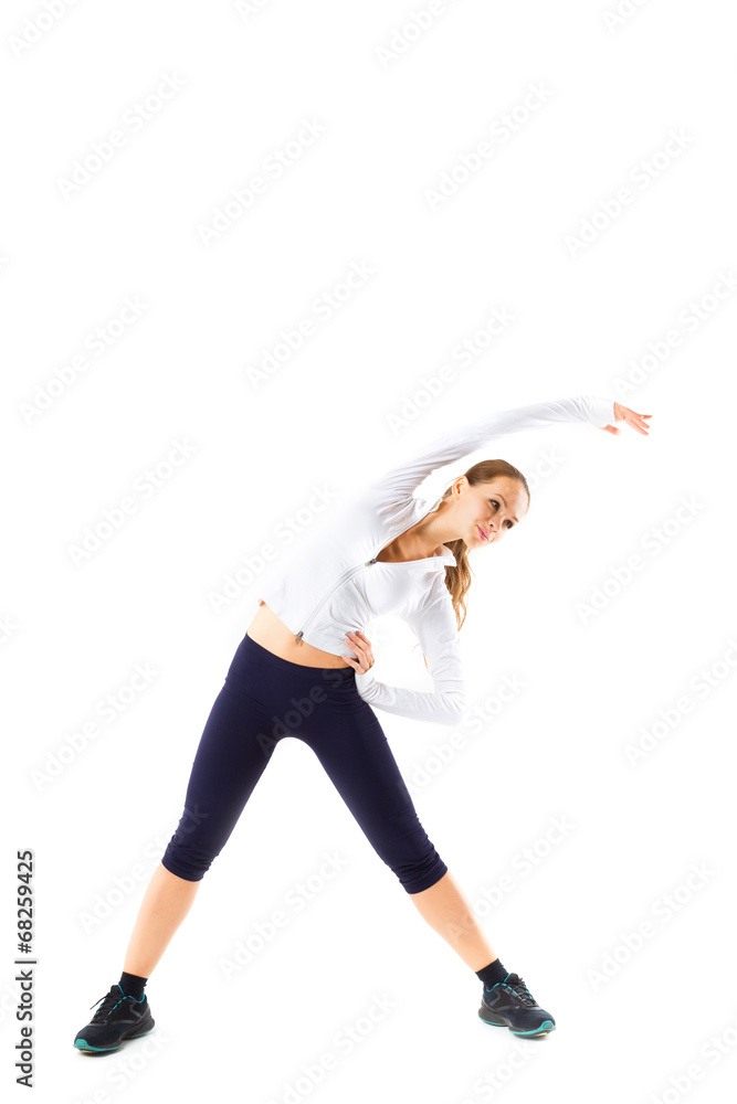 Young beautiful sports girl does fitness exercise stretching Young beautiful sports girl does fitness exercise stretching