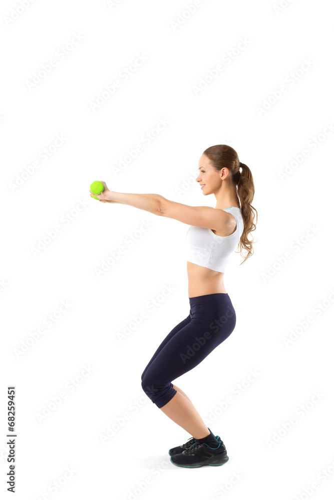 Young girl with dumbbells on a white background Young girl with dumbbells on a white background